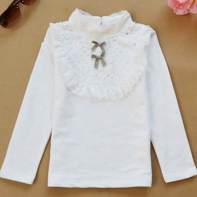 0-9Y Ruffle Tracksuit -White long-sleeve top with lace details on a beige background