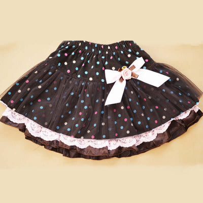 0-9Y Ruffle Tracksuit -Black polka dot skirt with a white bow on a beige background