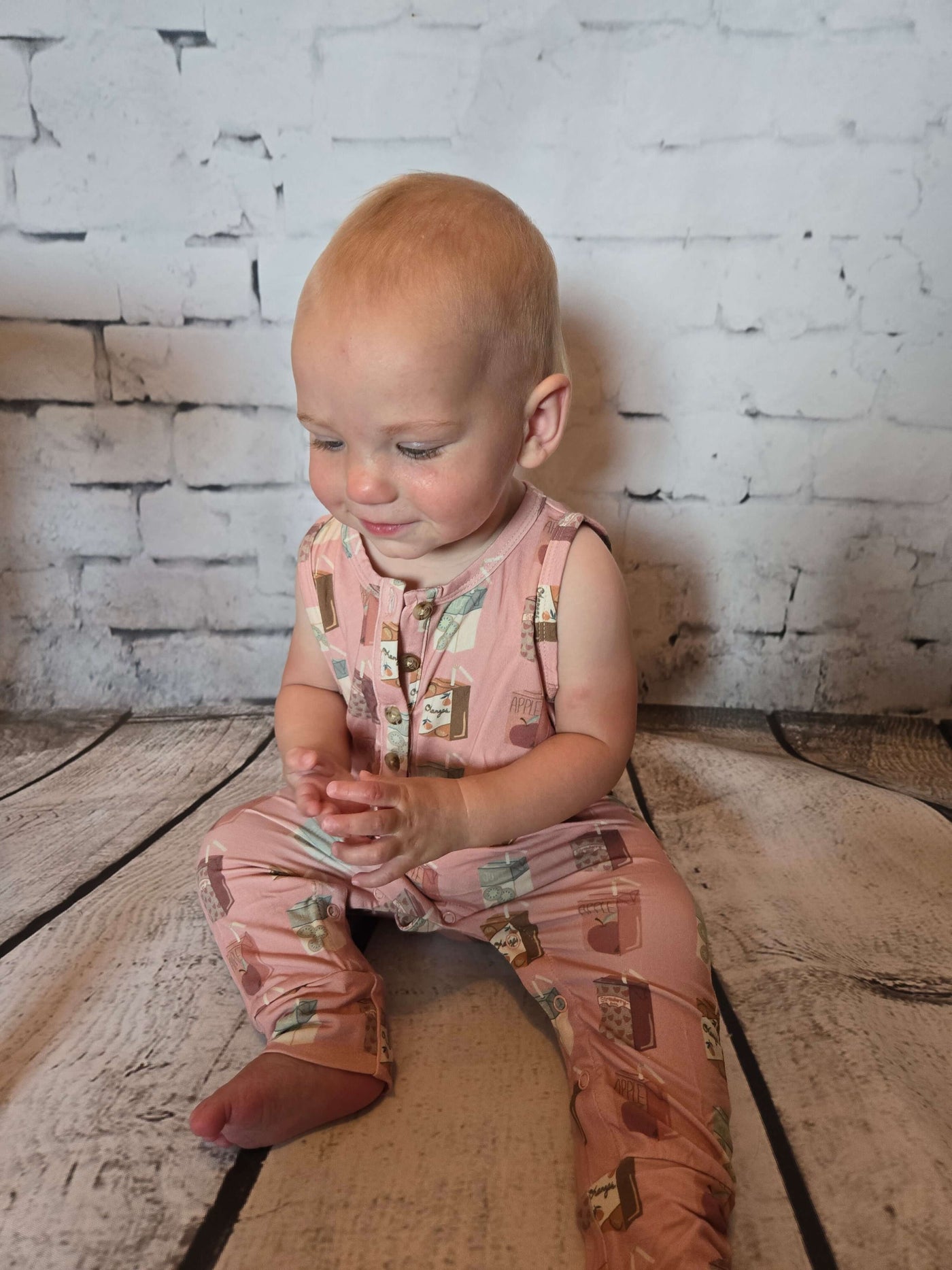 Girls_Henley_Tank_Romper_for_Infant_with_Juice_In_the_Box_Pattern_-_Lydia sitting