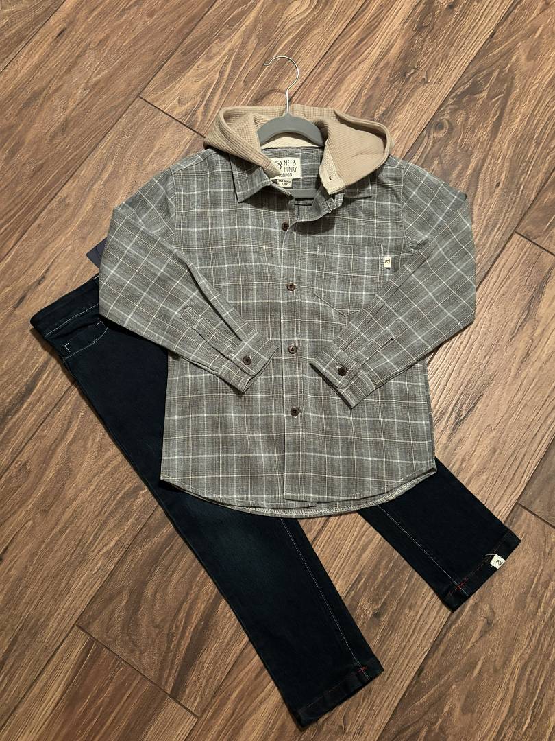 Plaid shirt and blue pants on a wooden floor