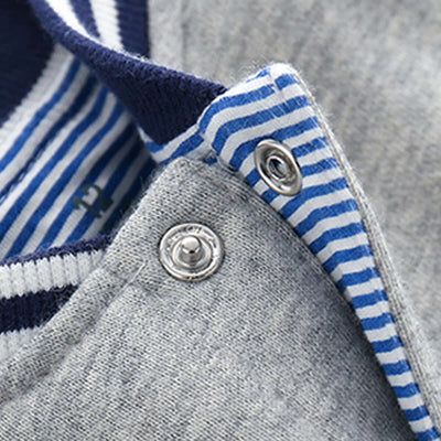 Boys Knit Cardigan Jacket-Close-up of a gray garment with blue and white striped trim and metal buttons.