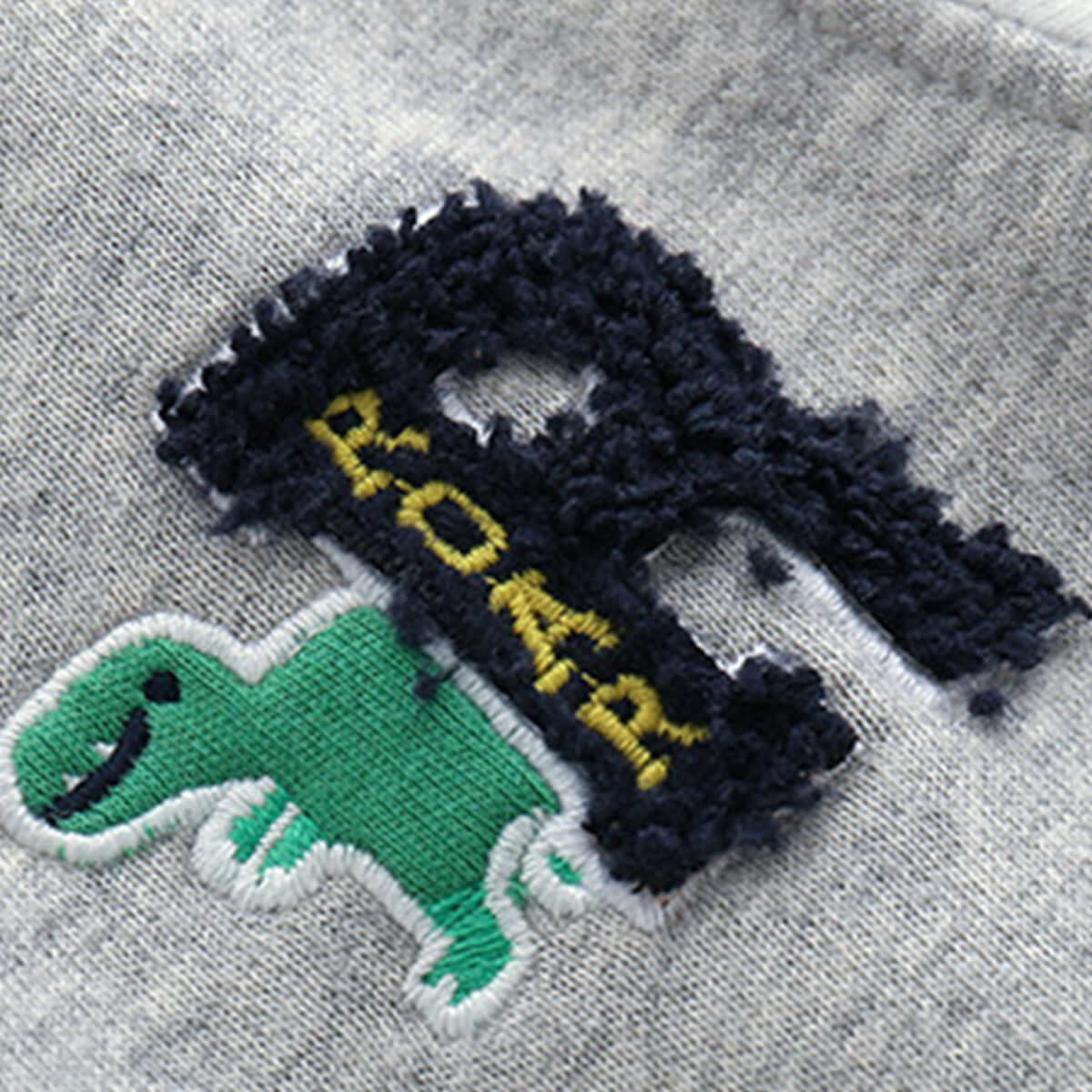 Boys Knit Cardigan Jacket-Embroidered dinosaur design on a gray fabric background