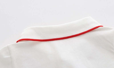Cartoon Car Boys Short Sleeve Polo Shirt-Close-up of a white fabric with a red thread on a light gray background
