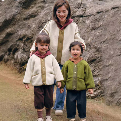 Casual Cardigan-Woman and two children wearing matching outfits standing in front of a rocky background