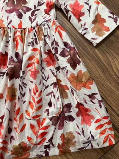 Falling Leaves 3/4 Sleeve Pocket Twirl Dress-Children's dress with autumn leaf pattern on a wooden surface