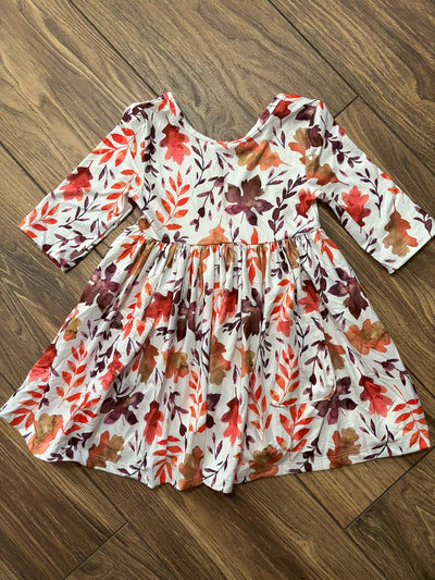 Falling Leaves 3/4 Sleeve Pocket Twirl Dress-Children's dress with autumn leaf pattern on a wooden floor