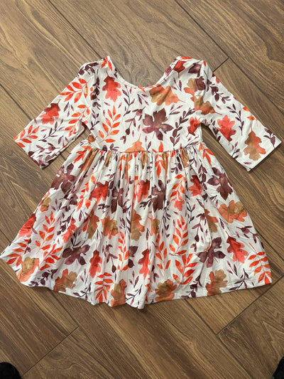 Falling Leaves 3/4 Sleeve Pocket Twirl Dress-Children's dress with autumn leaf pattern on a wooden floor