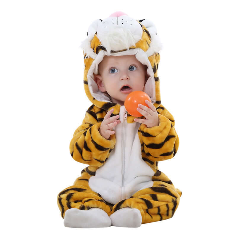 Flannel bodysuit-Child wearing a tiger-themed onesie holding an orange ball on a white background