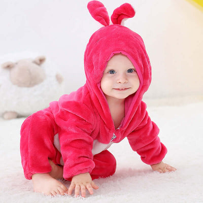 Flannel bodysuit-Baby in a pink caterpillar costume on a soft surface