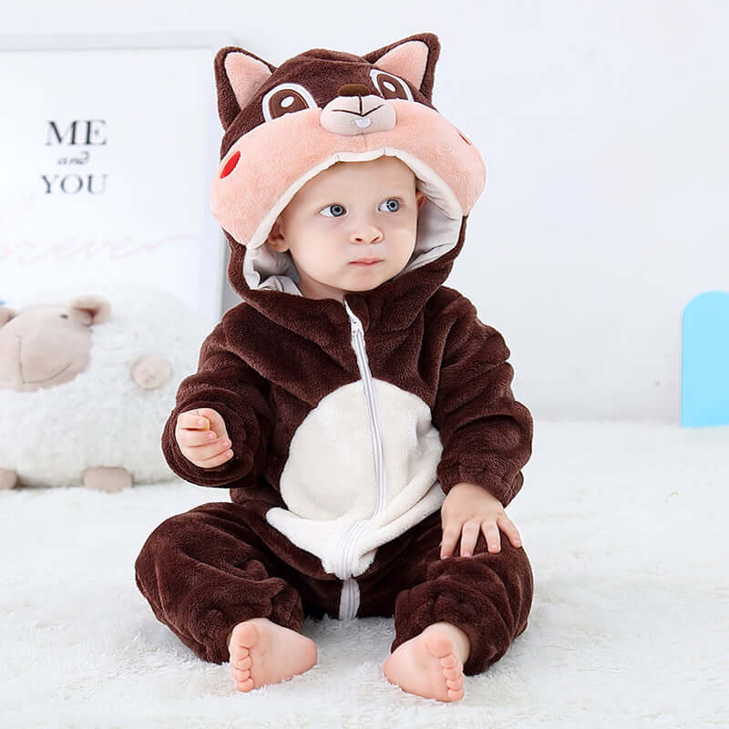 Flannel bodysuit-Baby in a brown and white animal onesie with a hood, sitting on a white surface.