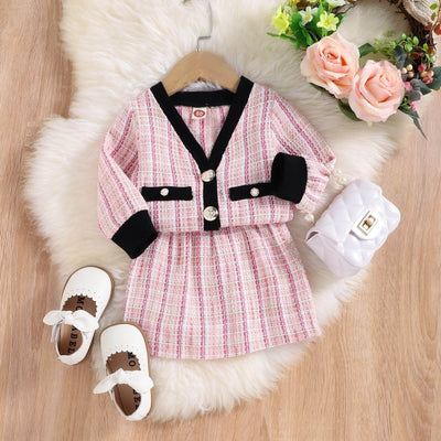 Girls Autumn Kafuu Woolen Top Skirt-Children's pink and black outfit with shoes and bag on a fluffy white rug