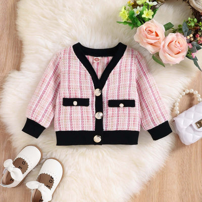 Girls Autumn Kafuu Woolen Top Skirt-Pink and black checkered jacket on a fluffy white rug with flowers and shoes around