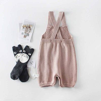 Knitted woolen bodysuit-Knitted baby romper with suspenders on a white background