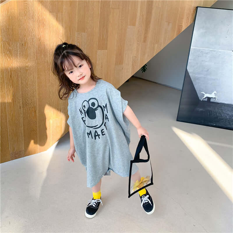 Loose Casual Short Sleeve Top-Child wearing a gray dress with a graphic design, standing indoors.
