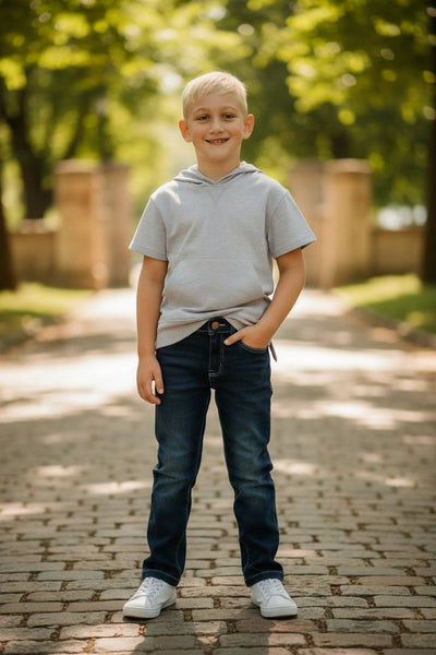 Mark Blue Denim Jeans by Me and Henry-Young boy standing on a paved path with trees in the background