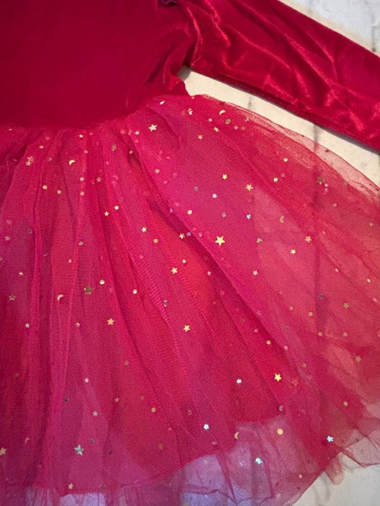 Red tulle fabric with star-shaped embellishments on a plain background