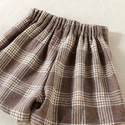 Solid Color Top  Plaid Skirt-Plaid patterned fabric with a focus on texture and color.