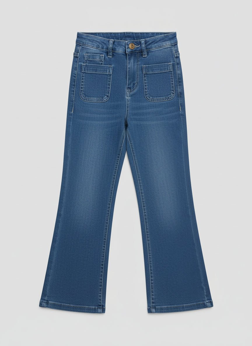 Thea_Jeans-Pair of blue jeans on a white surface