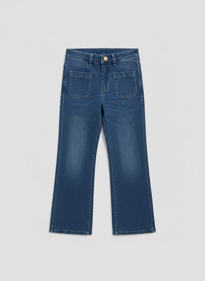 Thea Jeans-Pair of blue jeans on a white surface