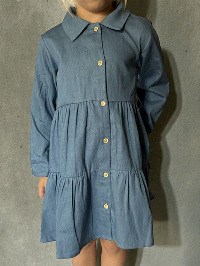 Blue dress with a collar and buttons on a gray background